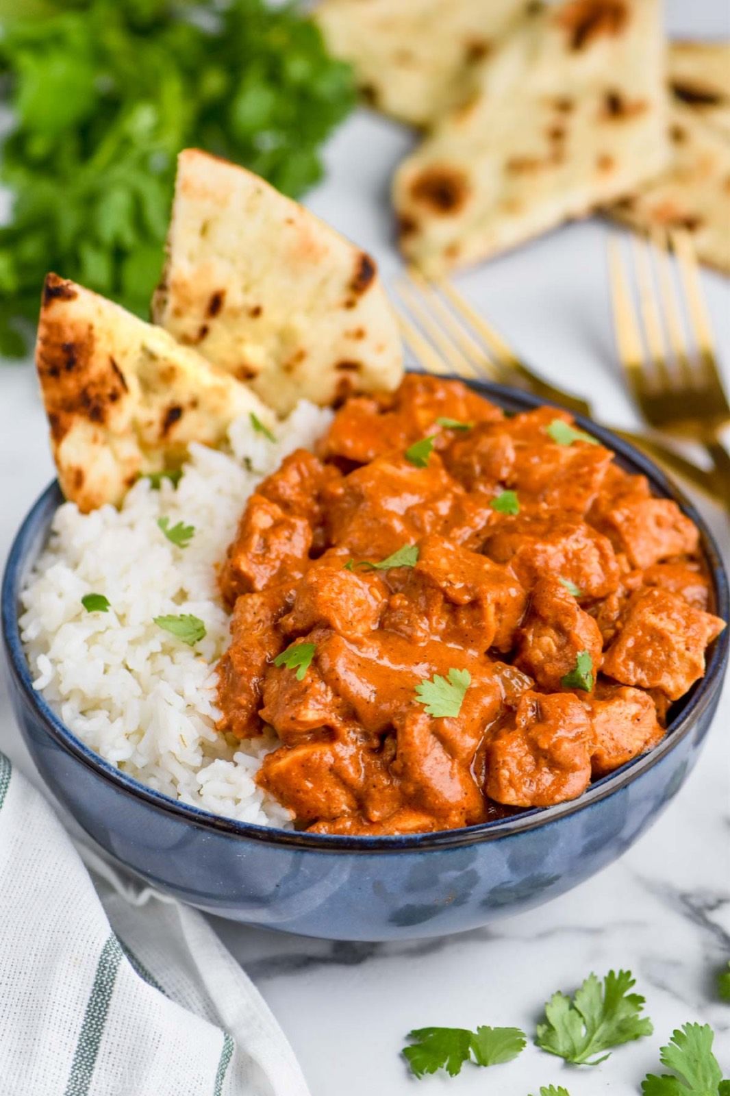 An assortment of curries with garlic naan